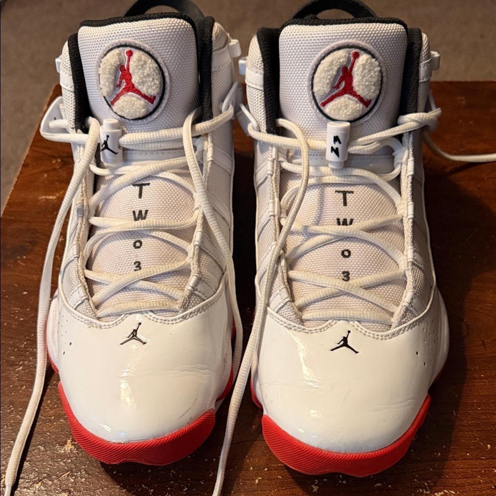 Jordan White Sneakers with Red Soles and Black Details